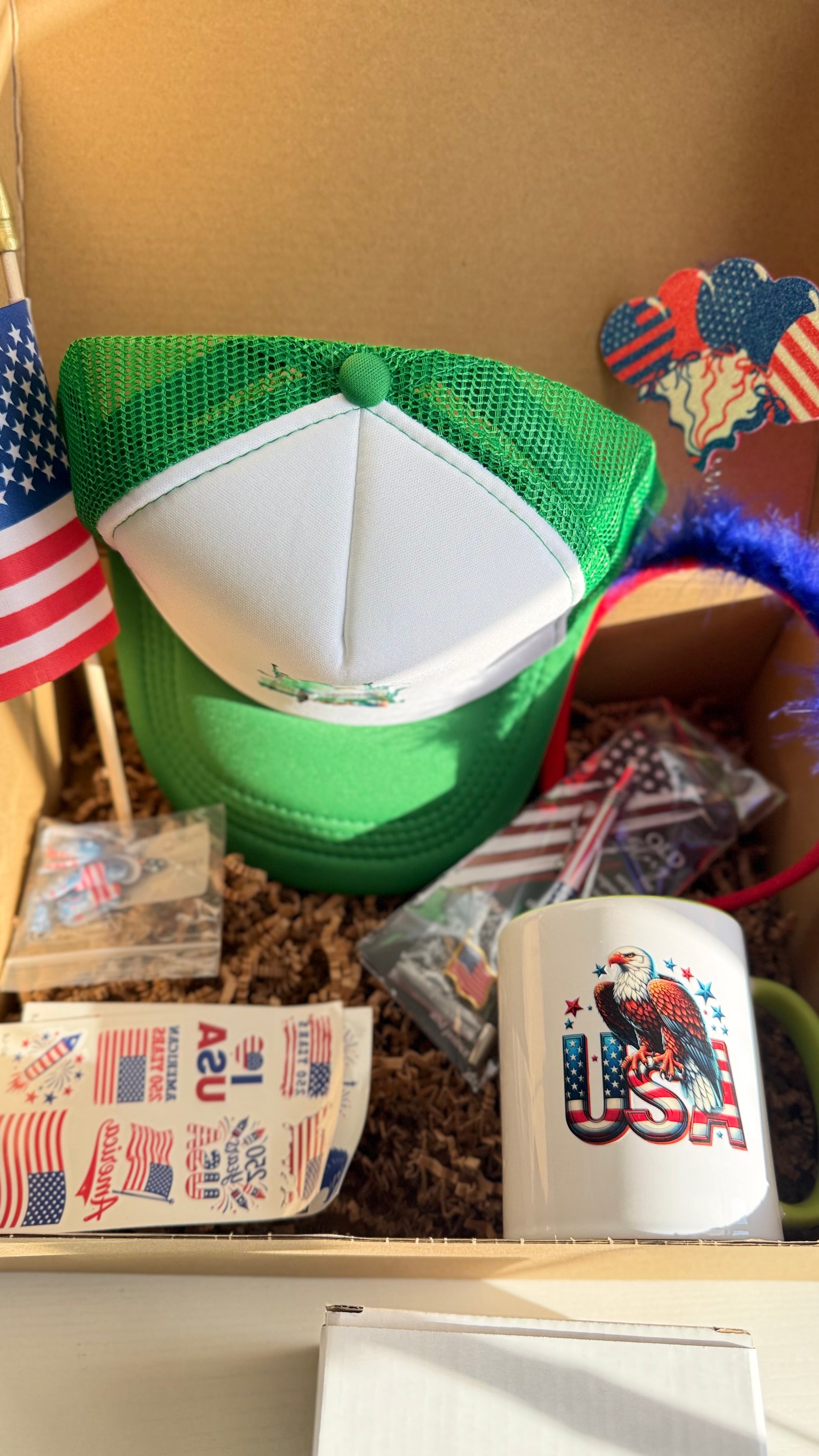 Patriotic USA Gift Set – Mug, Trucker Hat, American Flag, Press-On Nails, Pen, Stickers & Headband | 4th of July Gift Box