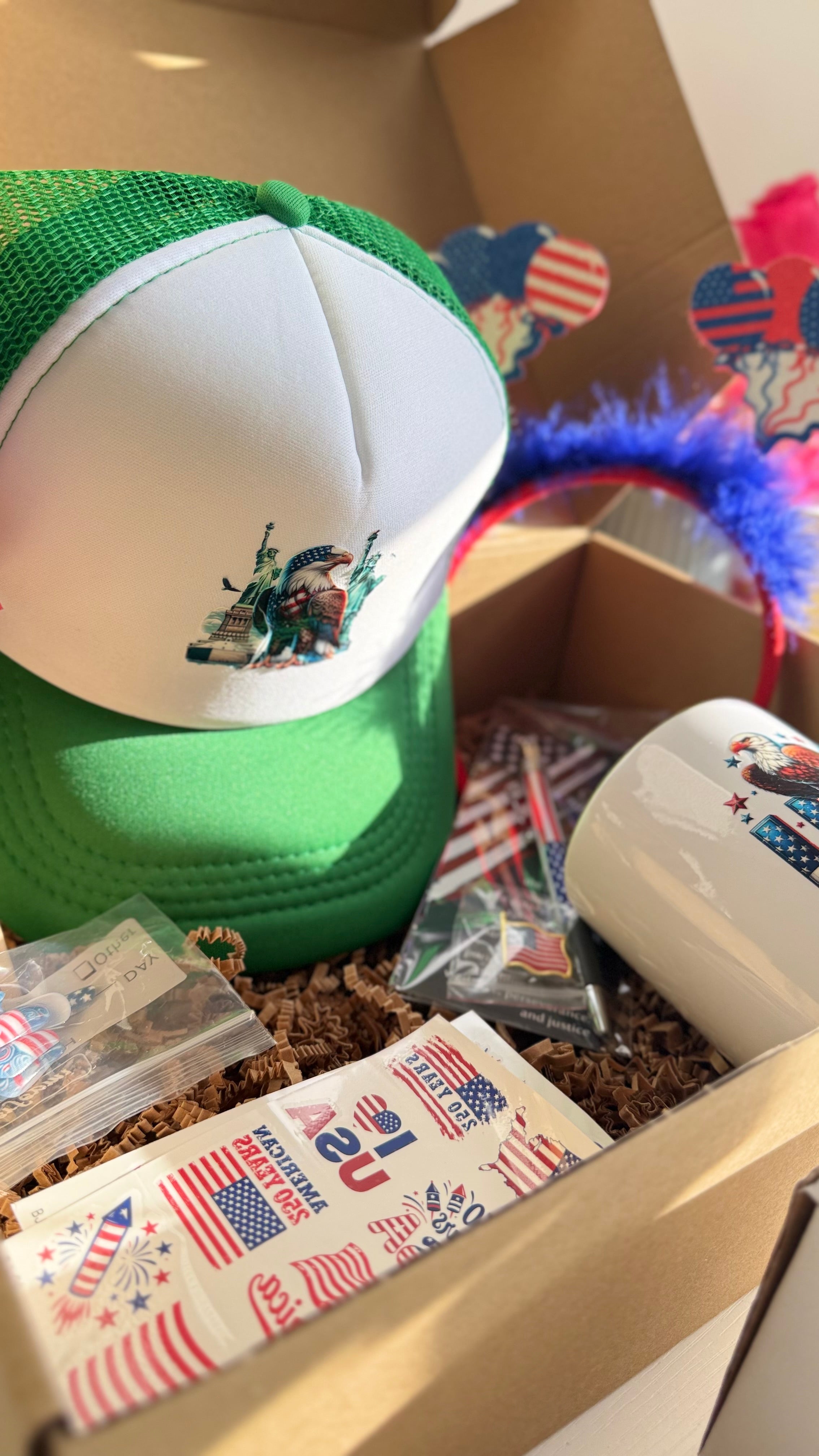 Patriotic USA Gift Set – Mug, Trucker Hat, American Flag, Press-On Nails, Pen, Stickers & Headband | 4th of July Gift Box