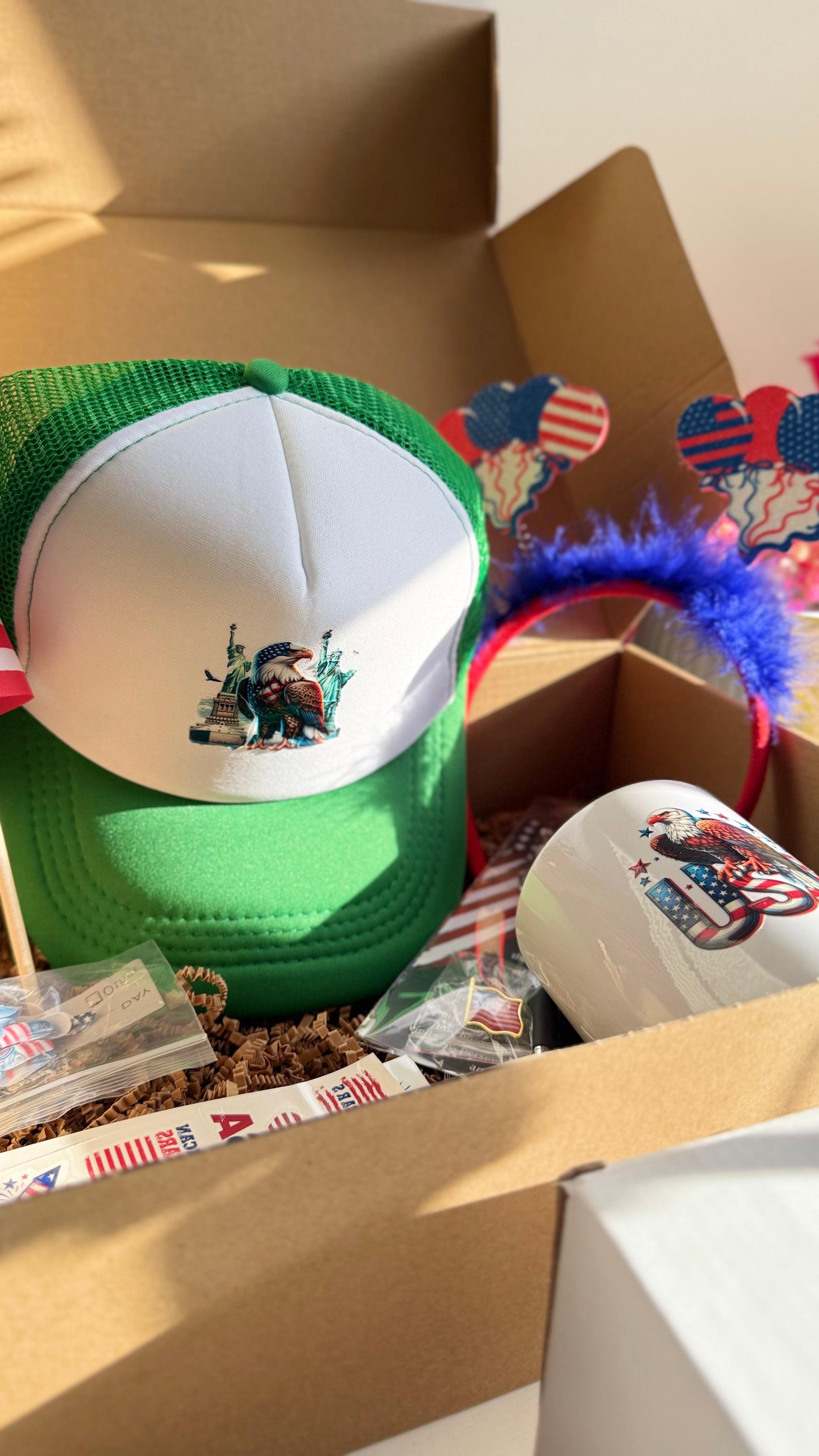 Patriotic USA Gift Set – Mug, Trucker Hat, American Flag, Press-On Nails, Pen, Stickers & Headband | 4th of July Gift Box